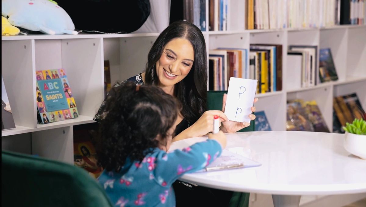 Lead & Succeed Education founder coaching a primary student